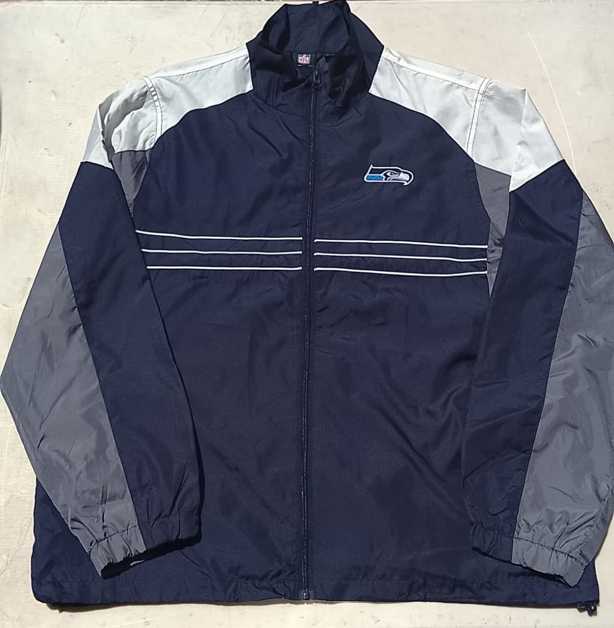 NFL-REEBOK ORIGINAL - SEATTLE SEAHAWKS - CHAMARRA ROMPEVIENTOS - NUEVO CON ETIQUETA MARSHALLS